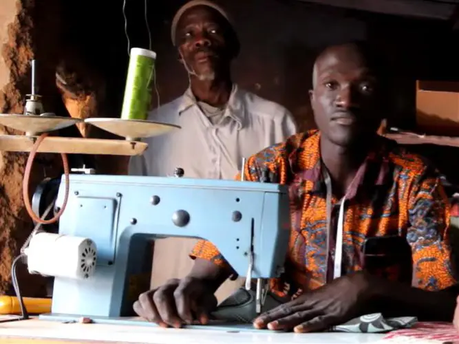 Local tailor working with electricity